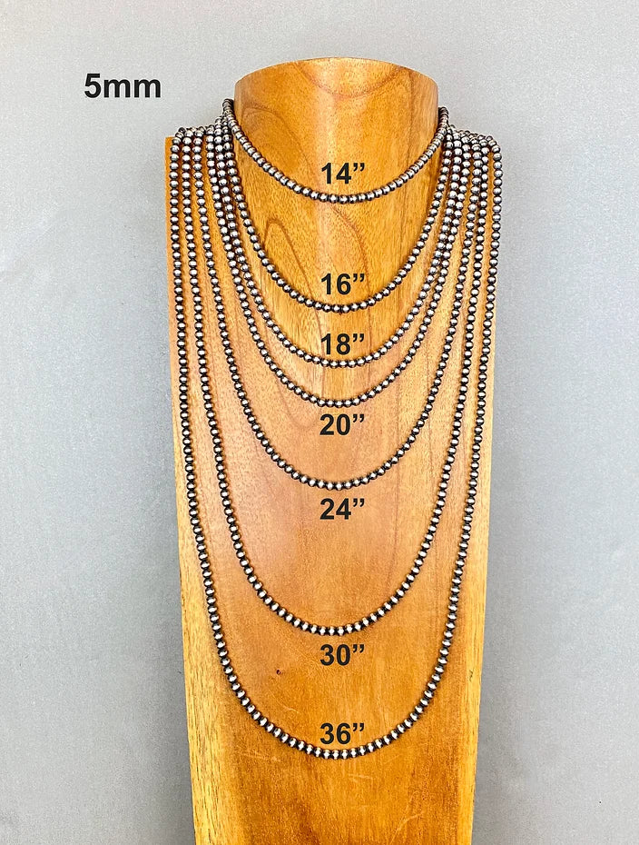 Set of sterling silver pearl beaded necklaces on a wooden mannequin with measurements displayed.