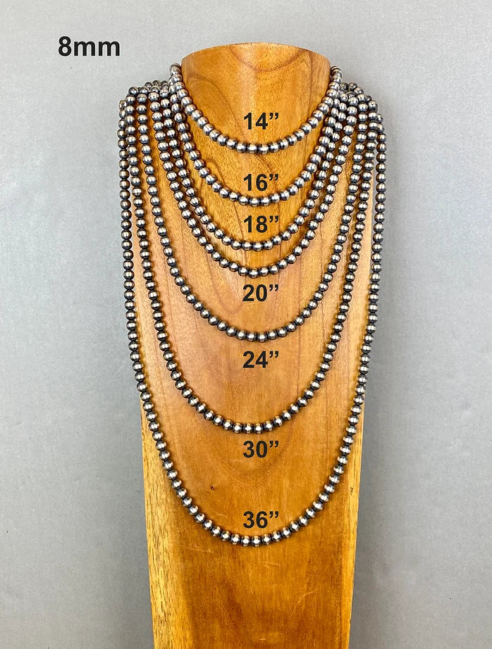Set of beaded necklaces on a wooden stand with measurements indicated.
