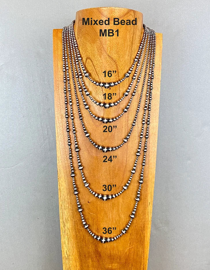 Set of mixed bead sterling silver pearl necklaces on a wooden stand with measurements.