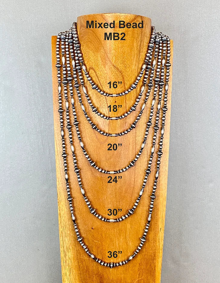 Set of mixed bead sterling silver pearl necklaces on a wooden display with measurements.