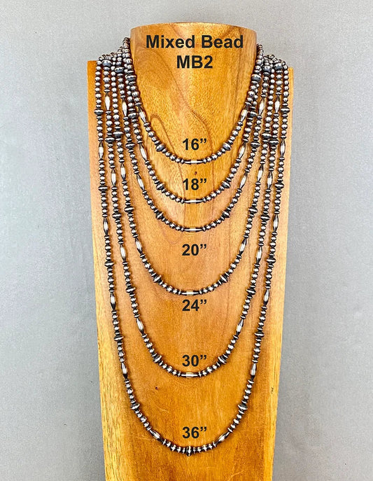 Set of mixed bead sterling silver pearl necklaces on a wooden display with measurements.